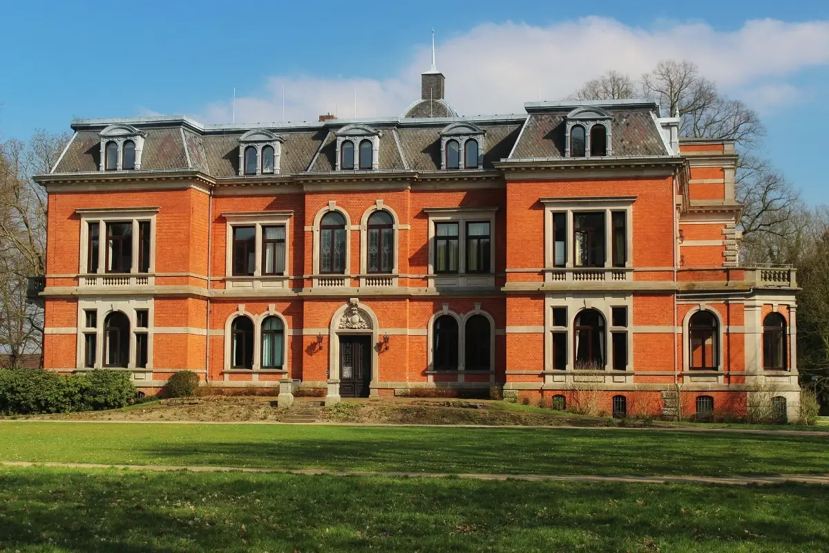 Red brick mansion with arched windows